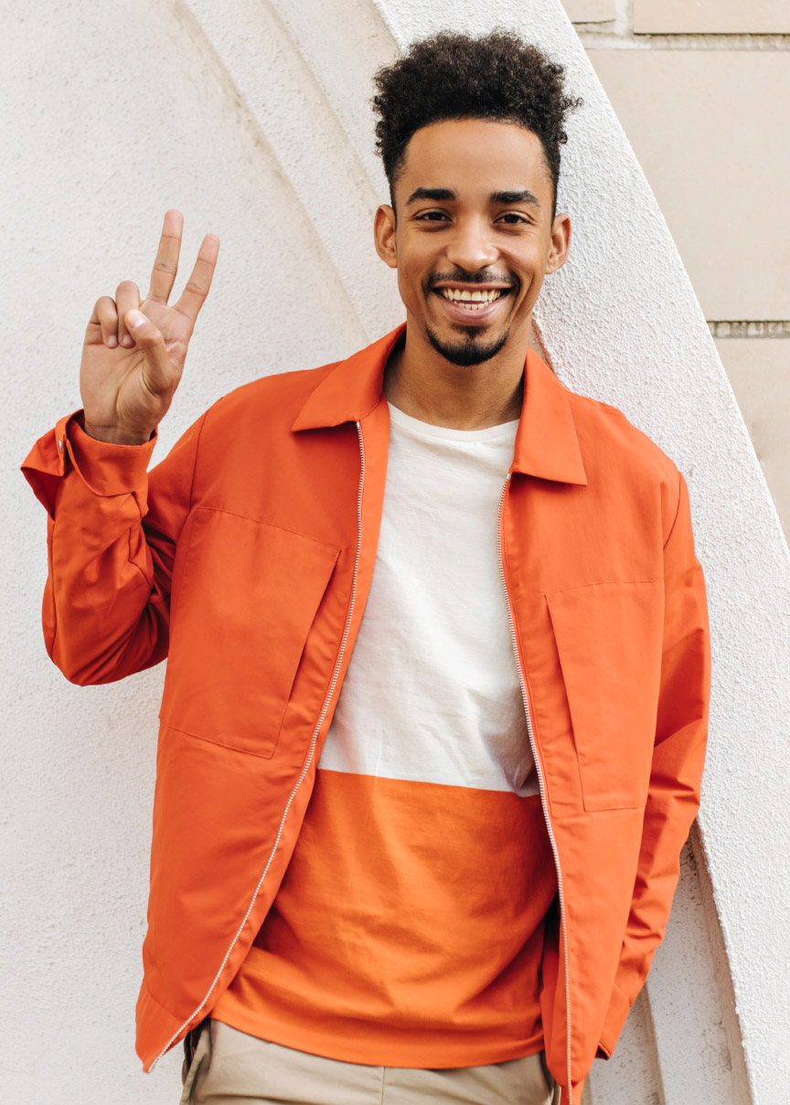 happy-cheerful-brunet-dark-skinned-man-in-orange-j-6KW4NEL.jpg